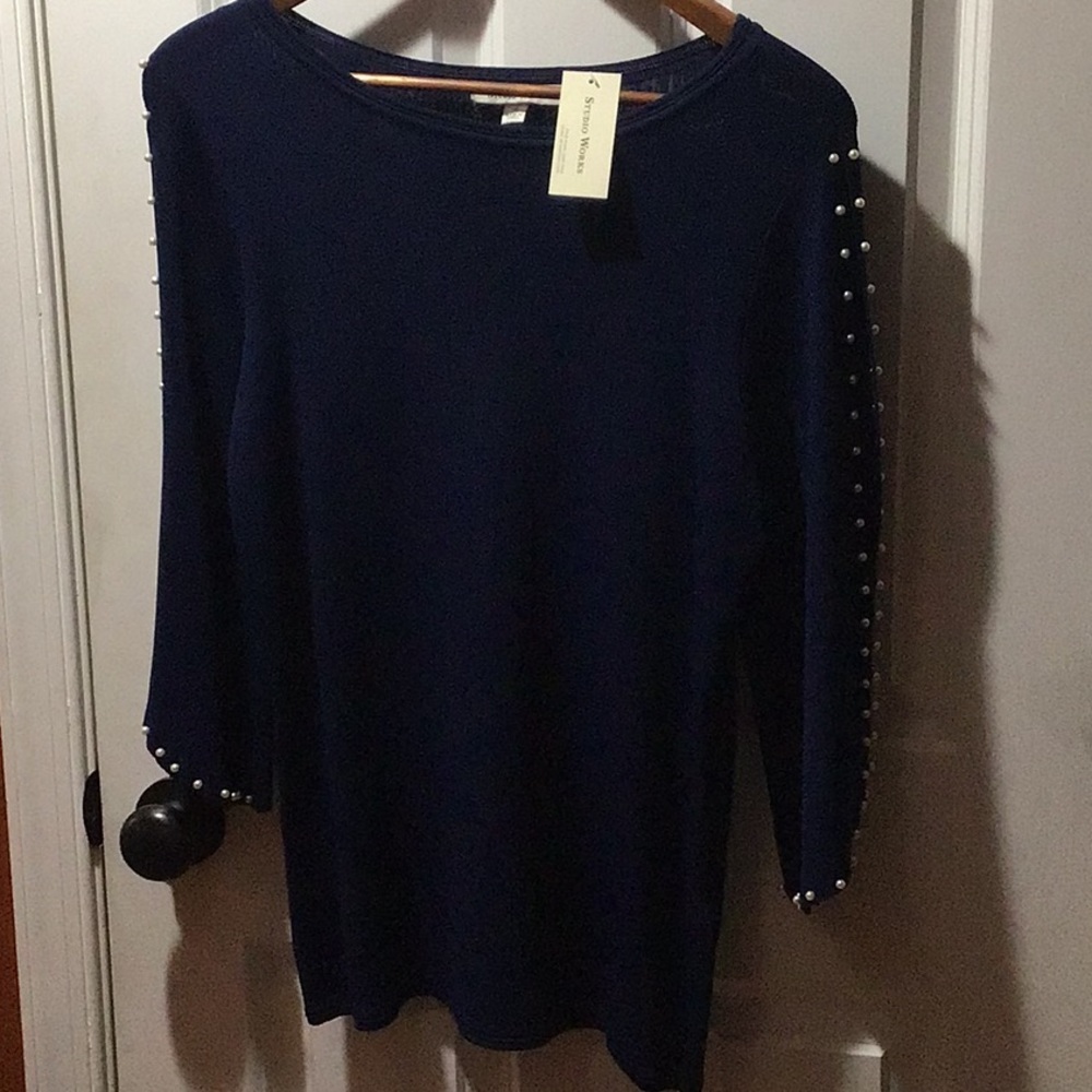 Brand new dark navy blue sweater. 2 rows of white pearls on the sleeve.